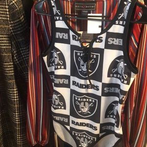 A brand new Raiders bodysuit.